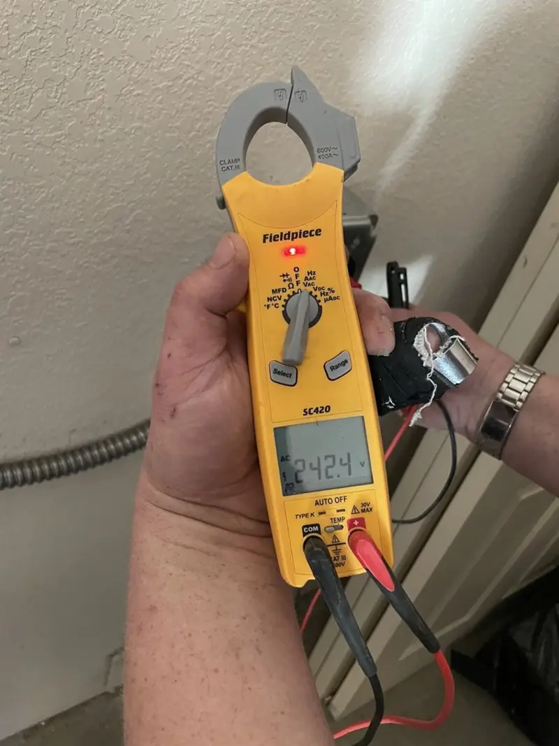 Voltage testing with clamp meter during Electrical Installation Services in Montesano